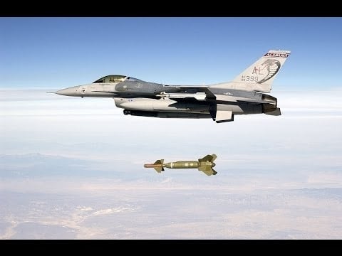 A documentary showcasing a fully equipped F16 Falcon Fighter Jet in HD as it flies over a bomb.