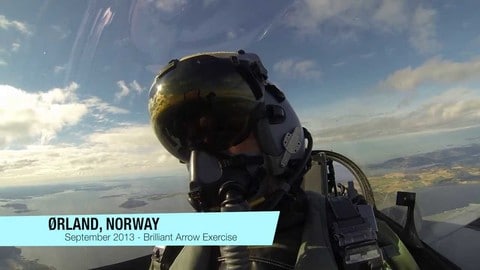 A Polish Air Force F-16 Pilot discusses working in a NATO environment while flying a fighter jet in the sky.