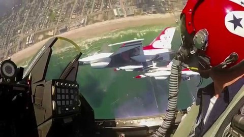 A pilot is flying a USAF Thunderbirds fighter jet amidst solo thunder over the ocean.