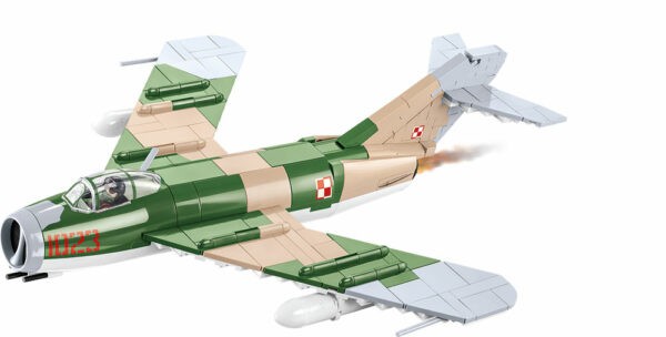 A toy model of a LIM-5 military jet flying on a white background.