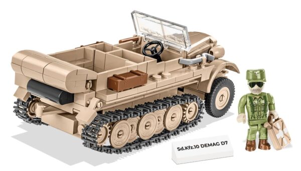 A toy soldier is standing next to a historic Sd.Kfz 10 Demag D7 #2273 vehicle.