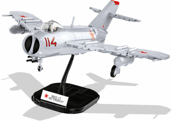 A Soviet MIG-17 NATO CODE "FRESCO" fighter jet model on a stand.