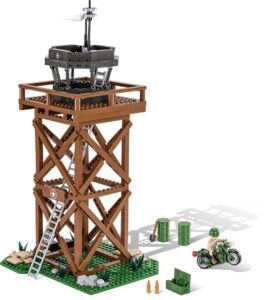 A tower at the C.O.H.3 US Air Support Center #3042 with a motorcycle on it.