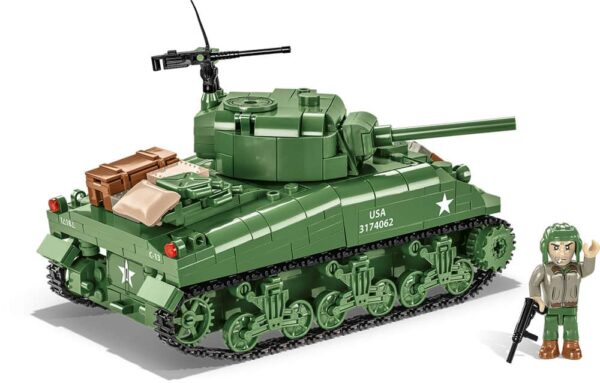 A man standing next to a C.O.H.3 Sherman M4A1 #3044 tank.