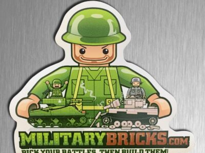 Military soldier playing with Cobi tanks fridge magnet.