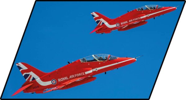 Two BEA Hawk T1 Red Arrows #5844 performing aerial maneuvers.