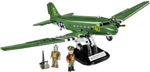 A soldier and a gun on board a green Douglas C-47 Skytrain (Dakota) #5743.