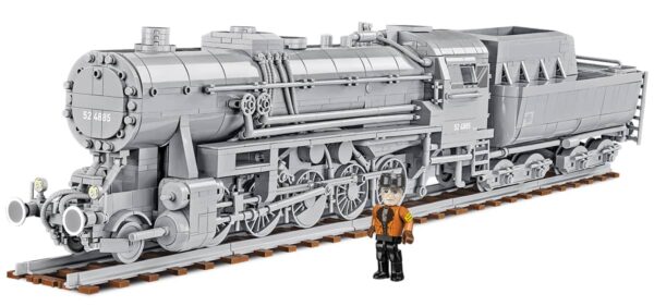 A model train of a Kriegslokomotive Baureihe 52 #6281 with a person standing beside it.