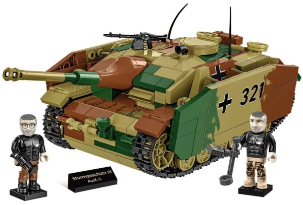 A Cobi Sturmgeschutz III AUSF.G Executive Edition Tank Hunter #2285 with two men and a soldier standing next to it.
