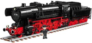 DRB Class 52 German Steam Locomotive #6282 displayed alongside a man.